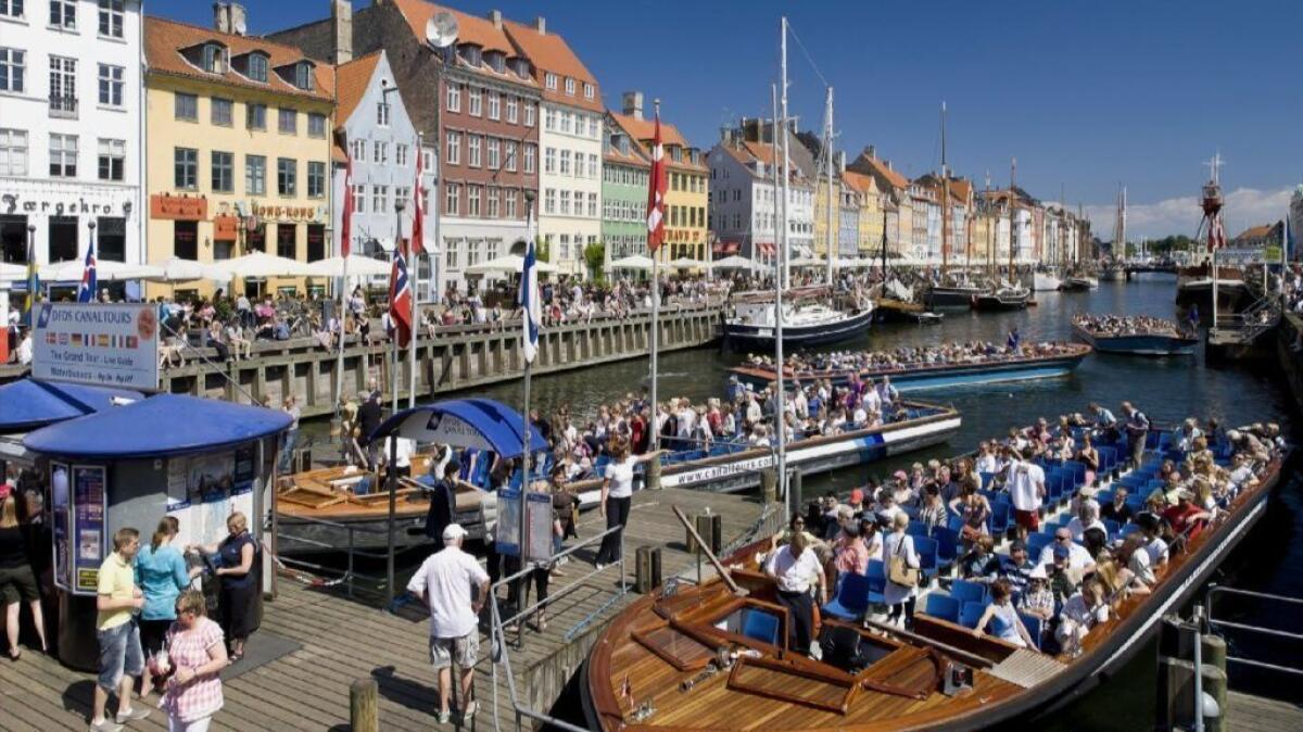 Tour boats in Copenhagen, Denmark, which was selected as Lonely Planet's top city to visit in 2019.