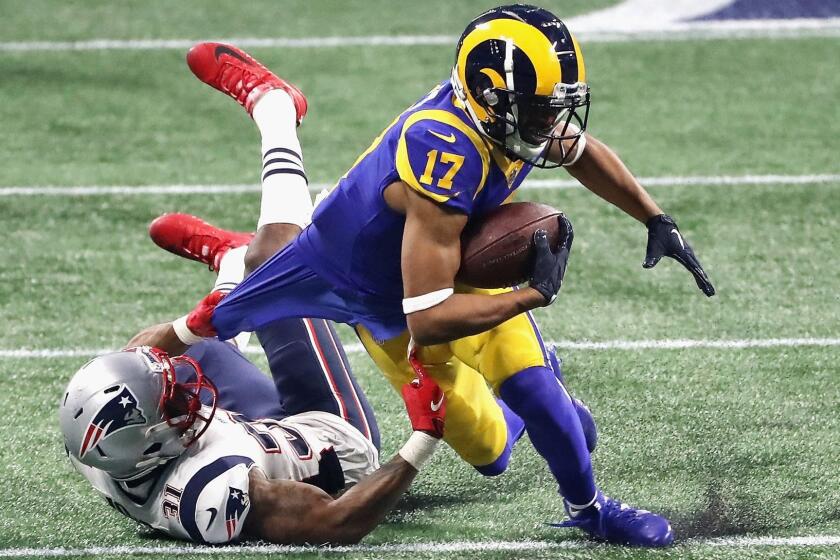 ATLANTA, GA - FEBRUARY 03: Jonathan Jones #31 of the New England Patriots tackles Robert Woods #17 of the Los Angeles Rams in the second half during Super Bowl LIII at Mercedes-Benz Stadium on February 3, 2019 in Atlanta, Georgia. (Photo by Elsa/Getty Images) ** OUTS - ELSENT, FPG, CM - OUTS * NM, PH, VA if sourced by CT, LA or MoD **