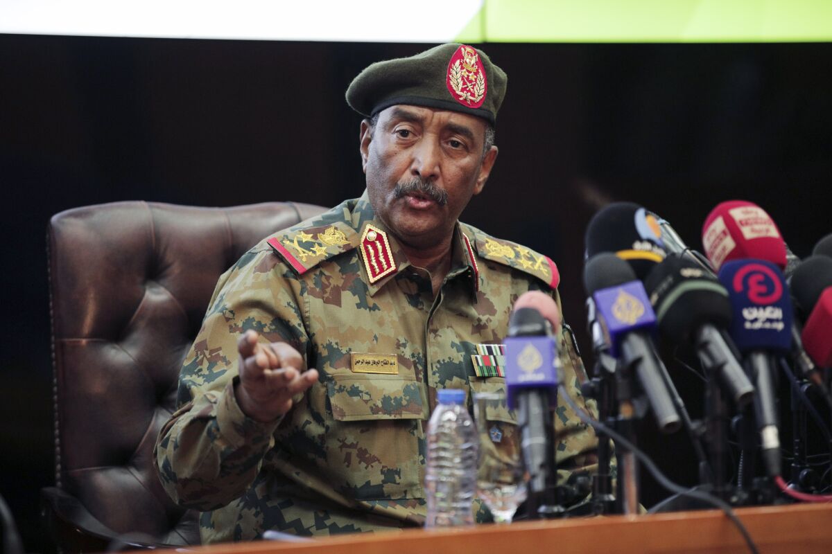 FILE - Sudan's head of the military, Gen. Abdel-Fattah Burhan, speaks during a press conference at the General Command of the Armed Forces in Khartoum, Sudan, Tuesday, Oct. 26, 2021. Gen. Abdel-Fattah Burhan, who heads Sudan’s ruling Sovereign Council is lauding recent ties with Israel, saying that intelligence sharing between the two former adversaries has helped arrest suspected militants in his country. Gen. Abdel-Fattah Burhan adds in an interview shown late Saturday, Feb. 12, 2022 that the relations are not of a political nature. (AP Photo/Marwan Ali, File)