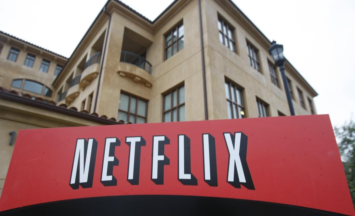 The company logo and view of Netflix headquarters in Los Gatos, Calif. The streaming service announced its most popular plan is getting a price hike