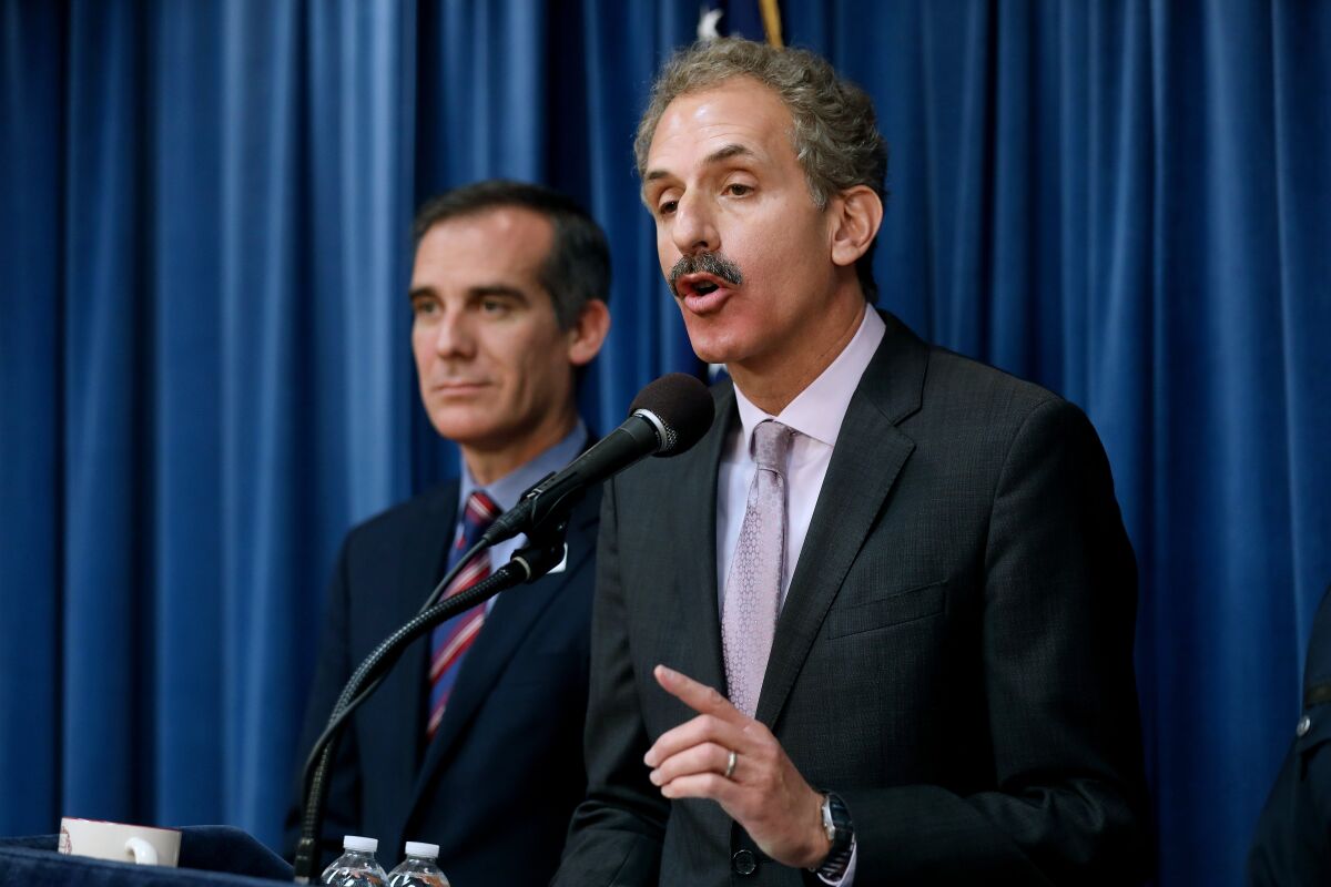 Los Angeles City Atty. Mike Feuer, right, and Mayor Eric Garcetti.