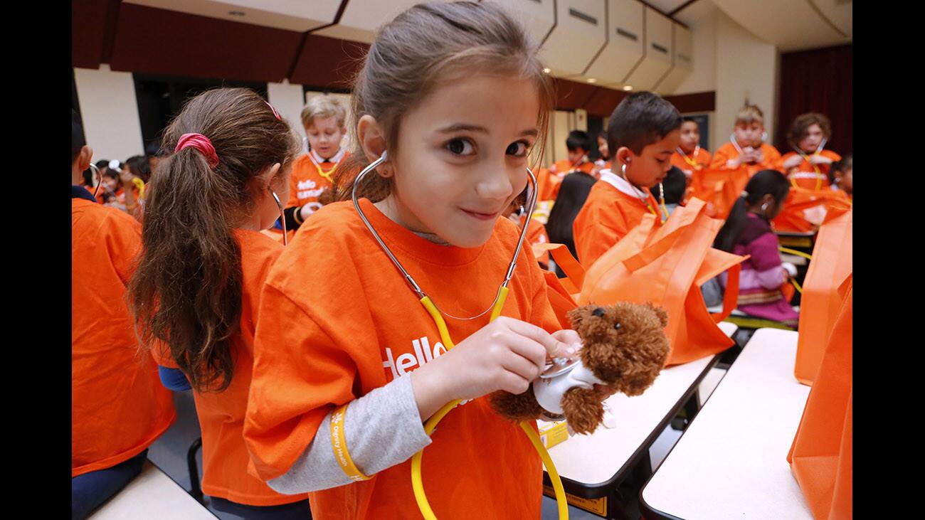 Cerritos Elementary student Narine Varosyan uses a stethoscope to check her teddy bear's heart, during the 2018 Great Kindness Challenge, at the school in Glendale on Wednesday, Jan. 24, 2018. Kids for Peace and Dignity Health Glendale Memorial Hospital and Health Center partnered to sponsor this event.