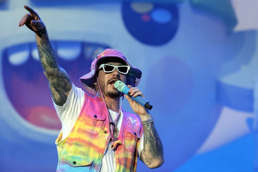 FILE - Singer J Balvin performs during the Coca-Cola Flow Reggaeton festival in Mexico City on Nov. 23, 2019. Latin trap kings Bad Bunny and J Balvin have a chance of winning the top honors at the Latin Grammy Awards. oth performers are double nominees for album of the year: their collaborative project, “Oasis," is up for the prize and their solo albums — Bad Bunny's “YHLQMDLG” and Balvin's “Colores" — are also in contention. (AP Photo/Ginnette Riquelme, File)