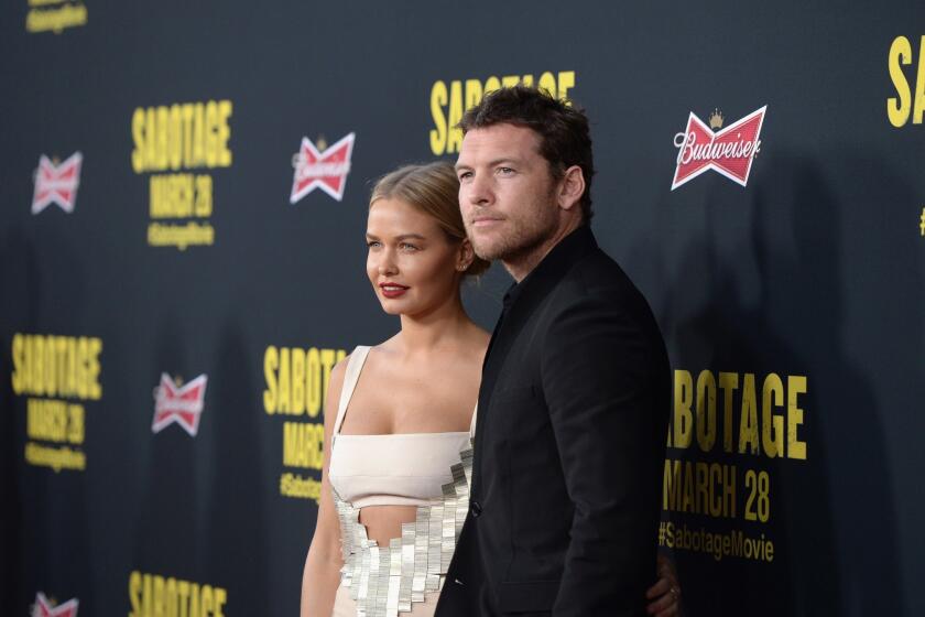 Sam Worthington, right, has reportedly reached a conditional agreement in his paparazzi assault case.