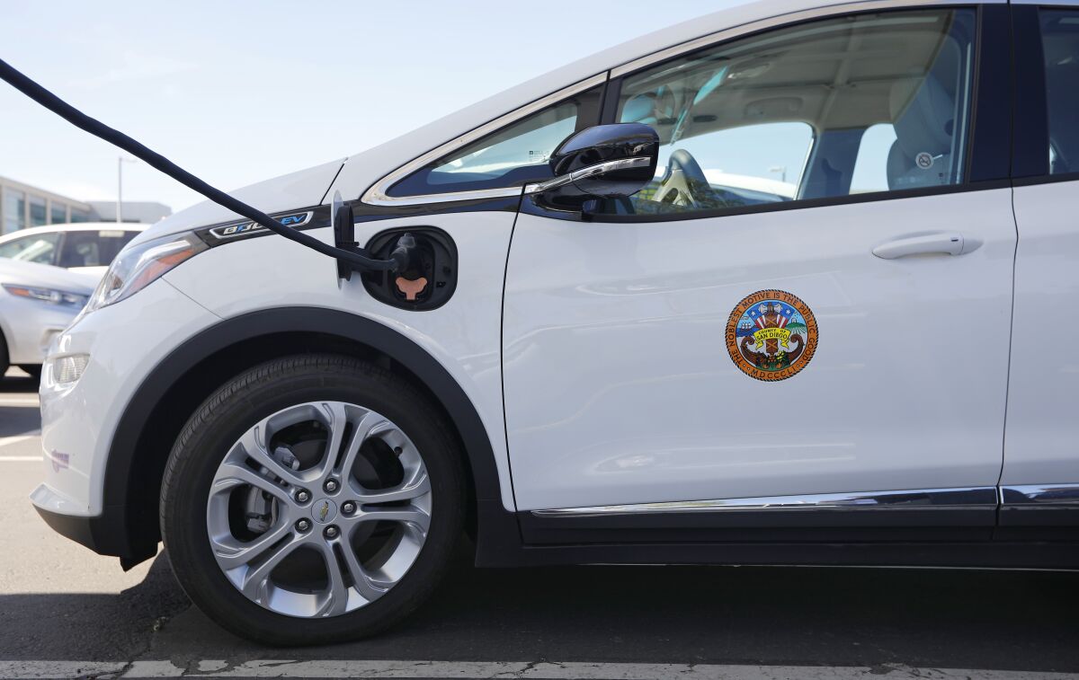 A county vehicle is plugged into a portable electric vehicle charging station 