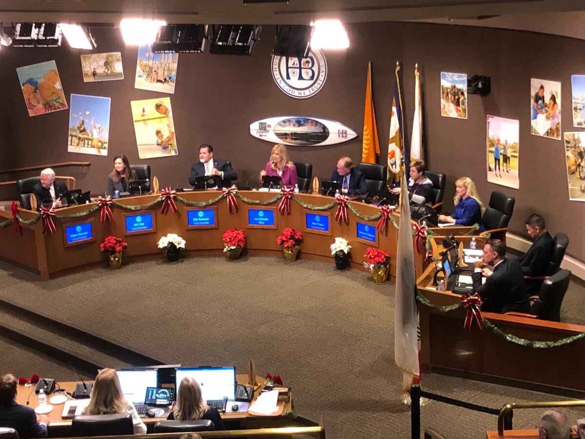 New Mayor Lyn Semeta assumes the center seat on the dais at Monday's Huntington Beach City Council meeting.