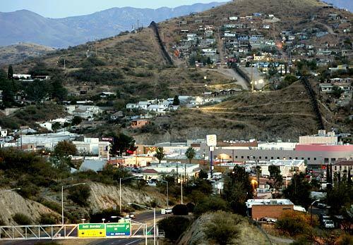 Businesses line Grand Avenue in Nogales, Ariz. The street goes to the borderline.