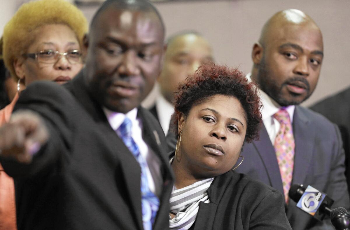 Mother Samaria Rice and family lawyers watch a video in March of Tamir Rice’s fatal shooting.