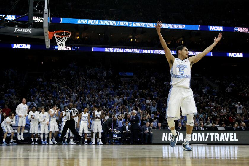 North Carolina's Marcus Paige celebrates after scoring against Indiana during the first half of a Sweet 16 game on March 25.