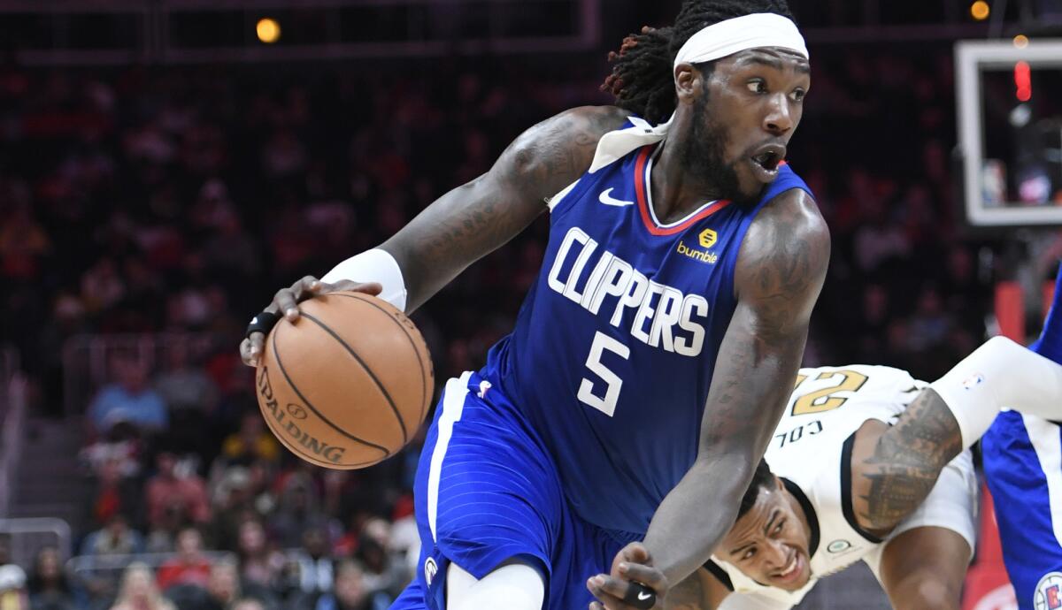 Clippers forward Montrezl Harrell drives against the Hawks during a game Monday in Atlanta.