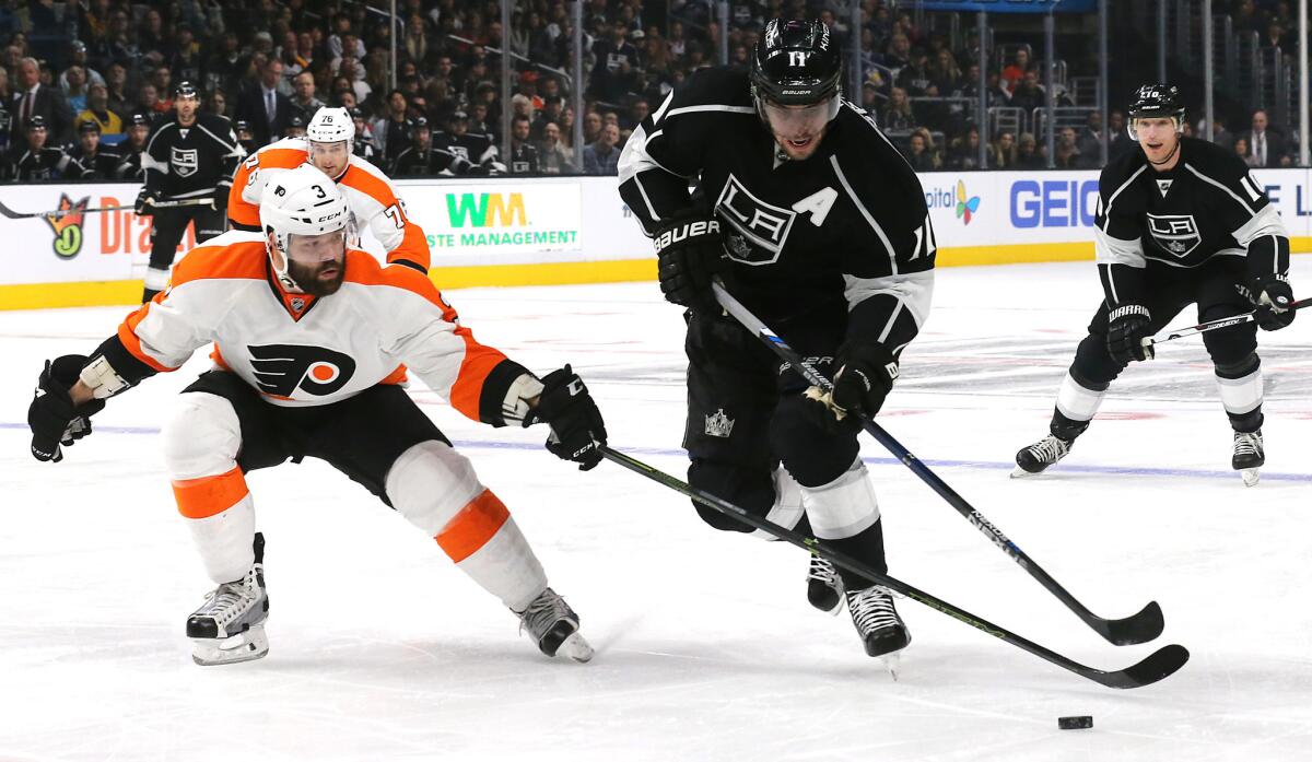 Kings center Anze Kopitar brings the puck up the ice against Flyers defenseman Radko Gudas during the first period of a game on Jan. 2.