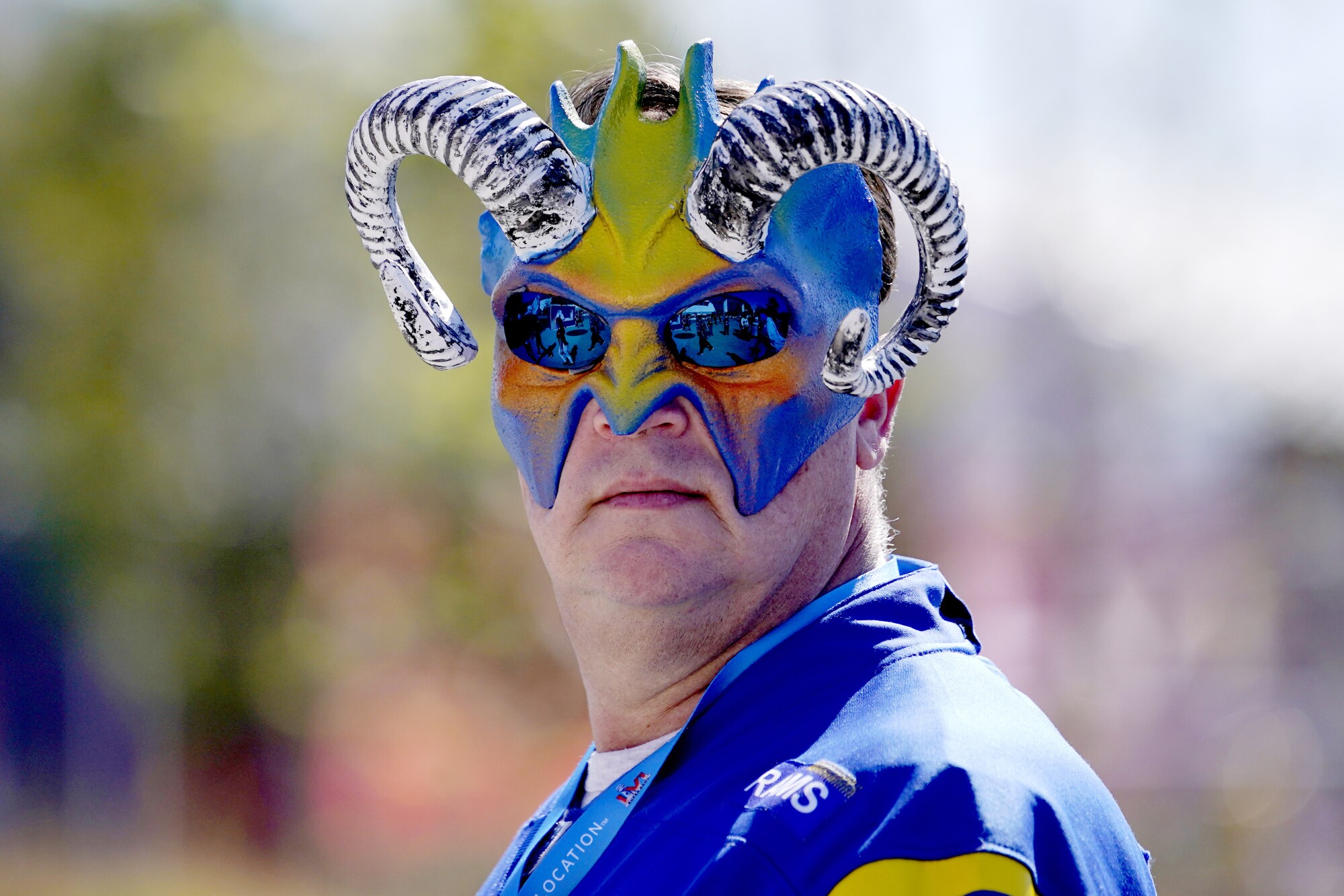 A Los Angeles Rams fan in a mask with ram horns 