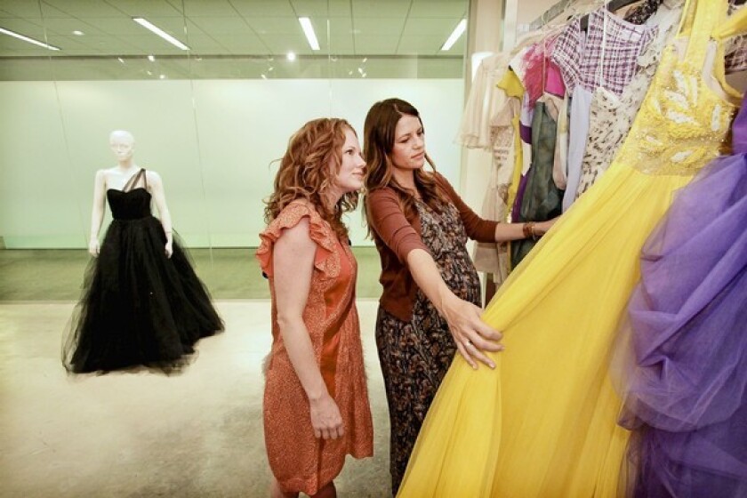 Sisterrs Nicole and Wendi Ferreira peruse gowns for actress Octavia Spencer.