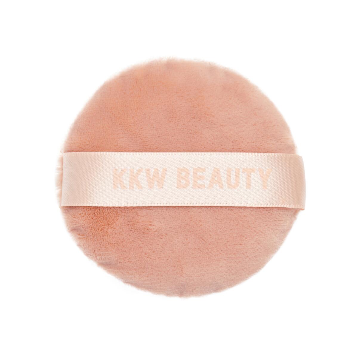 KKW Beauty is introducing a never-before-seen puff, sponge and sharpener and an exclusive cosmetic pouch this holiday season at the brand's Orange County pop-up shop. The puff is $10.