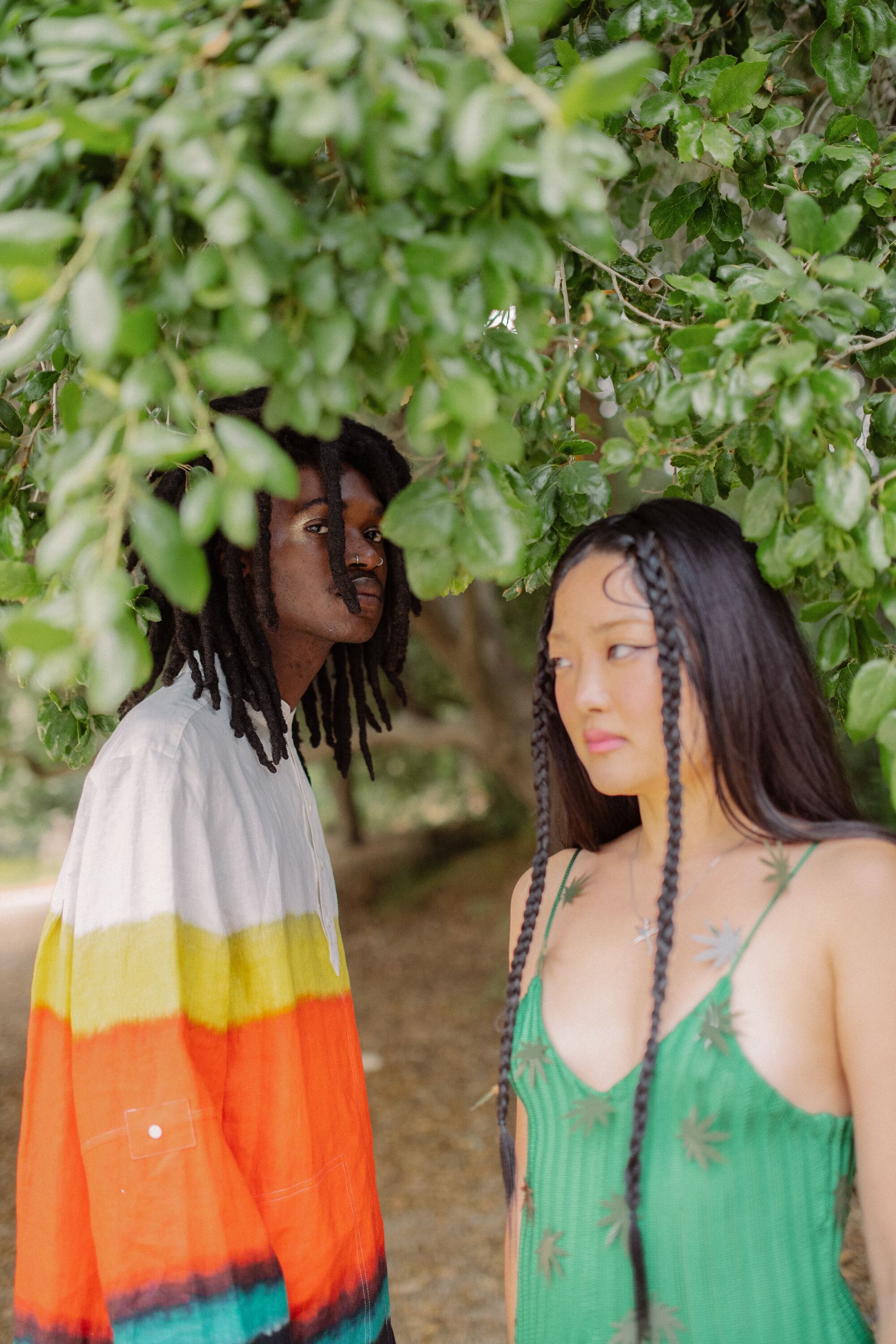 models under leaves of a tree