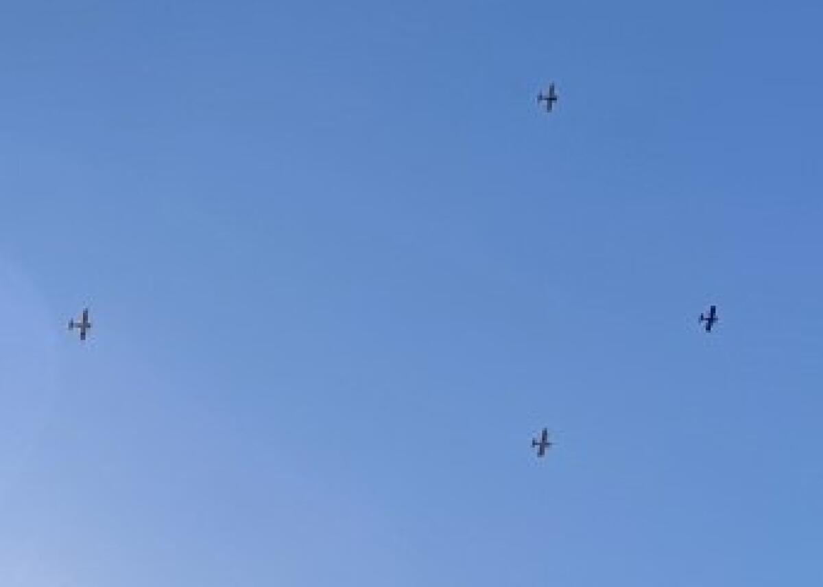 Four planes fly high above Scripps Green Hospital in La Jolla as part of an organized fly-over of San Diego-area hospitals.