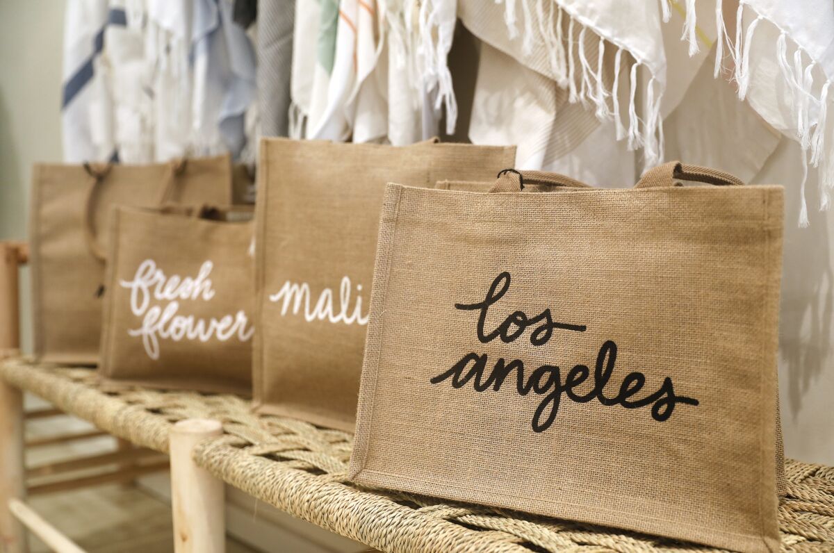 Reusable tote bags at the Little Market at Palisades Village in Pacific Palisades.