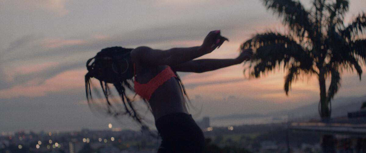 A woman dancing in the movie "She Paradise."