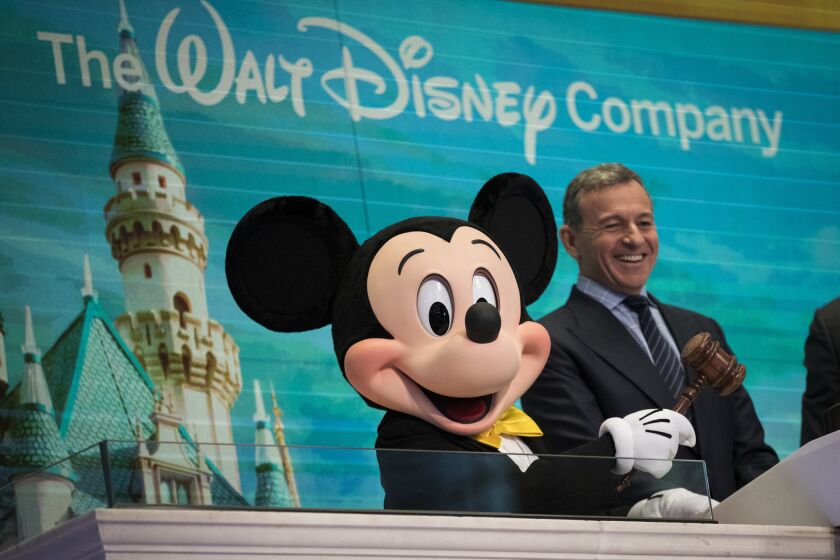 Mickey Mouse and chief executive officer and chairman of The Walt Disney Company Bob Iger 