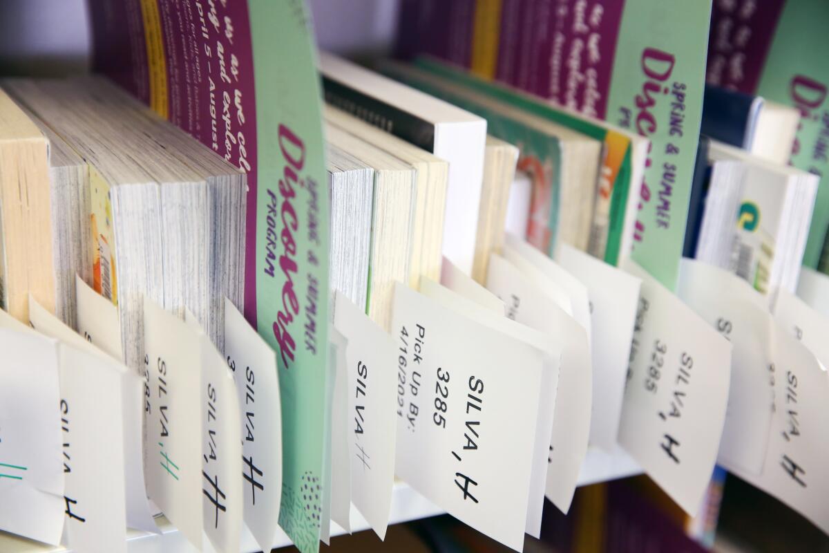 Books are organized on a shelf.