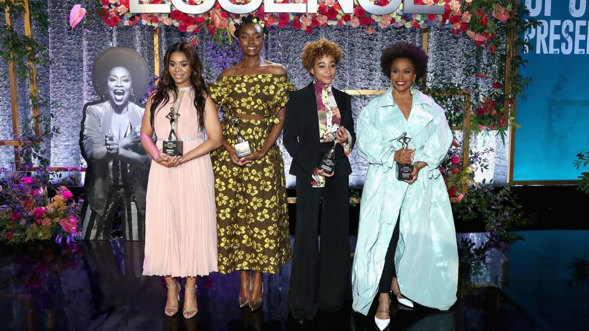 Honorees Regina Hall, left, KiKi Layne, Amandla Stenberg and Jenifer Lewis attend the 2019 Essence Black Women in Hollywood Awards luncheon at the Regent Beverly Wilshire Hotel on Feb. 21 in Los Angeles.