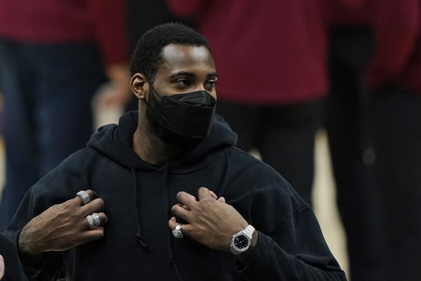 Andre Drummond in hoodie and mask before a Cavaliers-Thunder game in Oklahoma City.