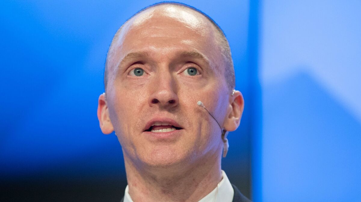 Carter Page speaks at a news conference in Moscow in December. (Pavel Golovkin / Associated Press)