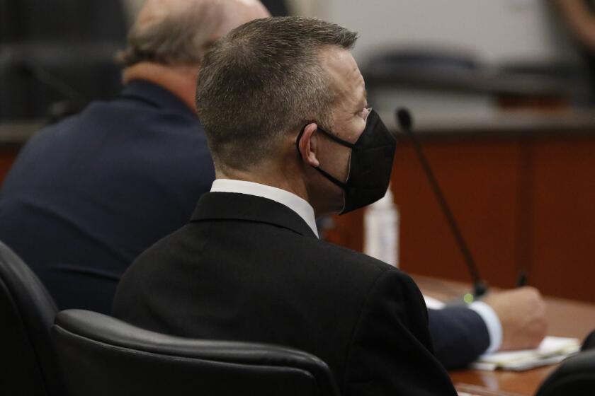 Paul Flores, right, listens after a jury found him guilty of murdering Cal Poly student Kristin Smart in Monterey County Superior Court on Tuesday, Oct. 18, 2022, in Salinas, Calif. Jurors unanimously found Flores guilty of first-degree murder. (Laura Dickinson/The Tribune via AP, Pool)