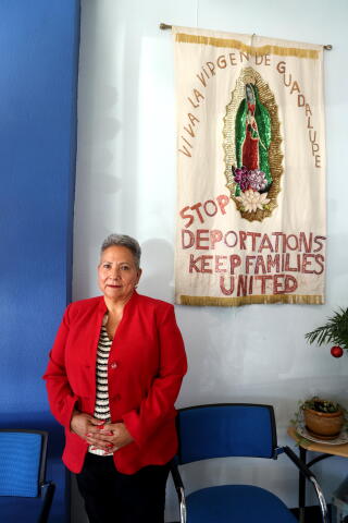 A woman poses for a portrait.