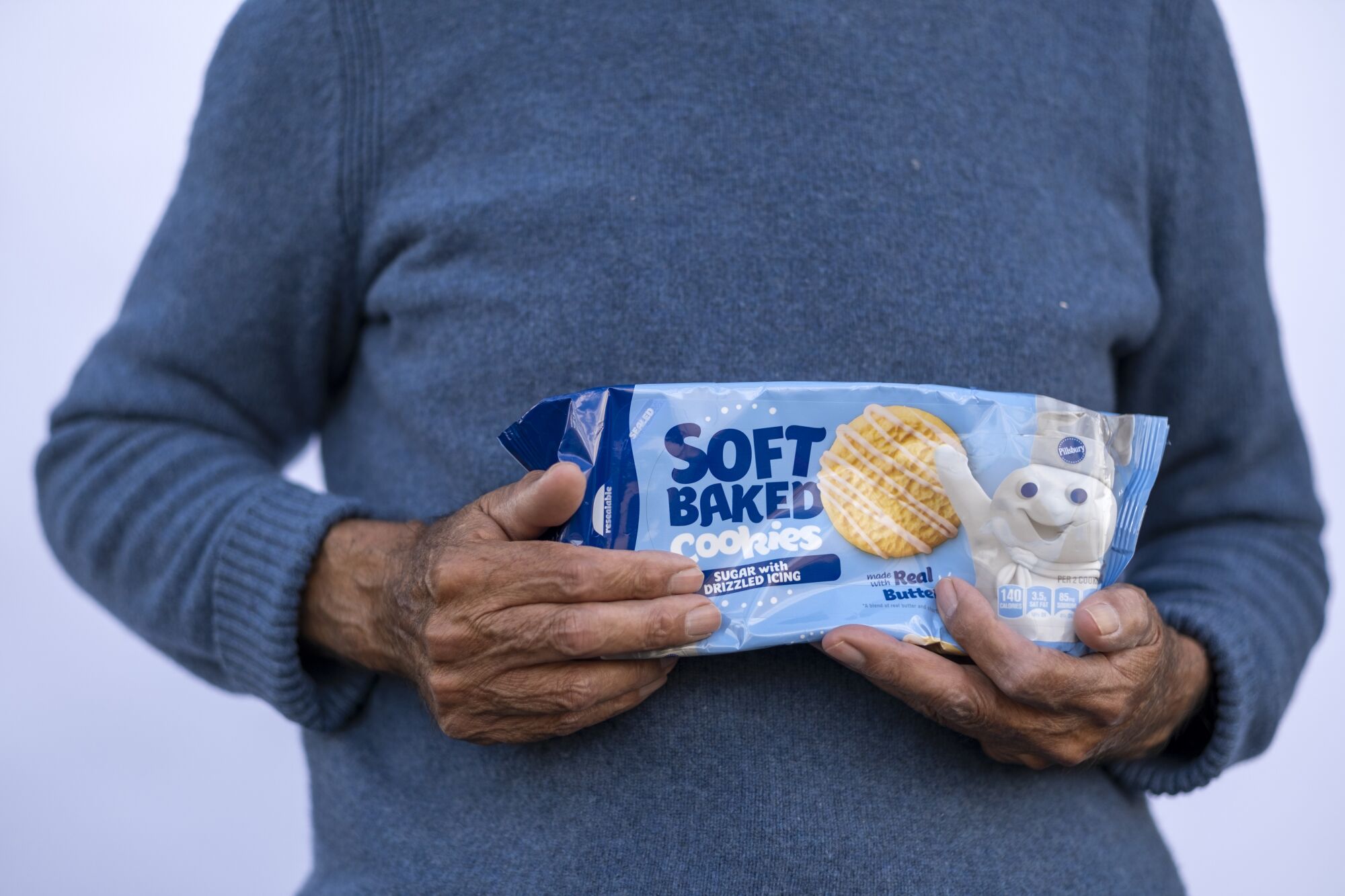 A man holds a package of cookies he received in Wilmington.