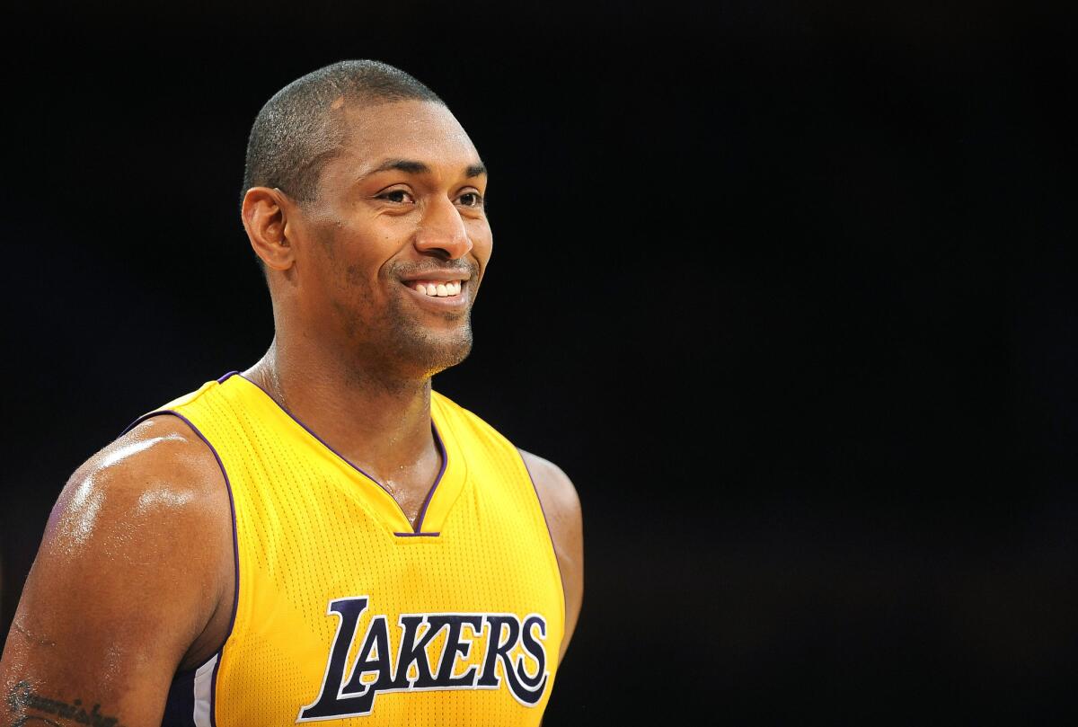 Lakers forward Metta World Peace plays in a preseason game against the Trail Blazers.