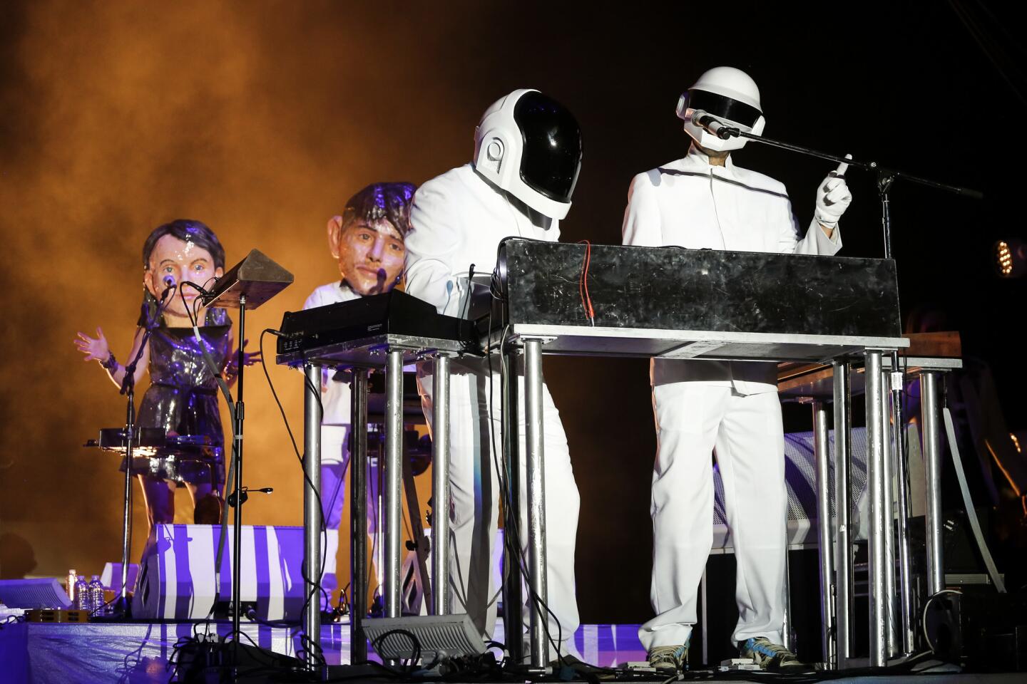 As Arcade Fire opened their Coachella Stage closing performance Sunday night, a pair resembling Grammy-winning duo, "Daft Punk," appeared and played a mellow version of "Get Lucky," only to be relieved of their stage duty by Fire's lead singer, Win Butler, April 20, 2014.