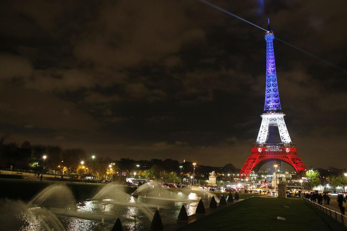 The Eiffel Tower illuminated with the colors of the French flag in memory of the dozens that were killed during a series of terrorist attacks on Nov. 13.