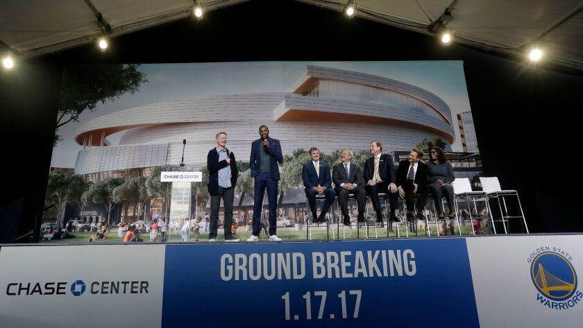 Golden State Warriors head coach Steve Kerr, left, and forward Kevin Durant, second from left, speak during a groundbreaking ceremony for the Chase Center in San Francisco on Jan. 17.