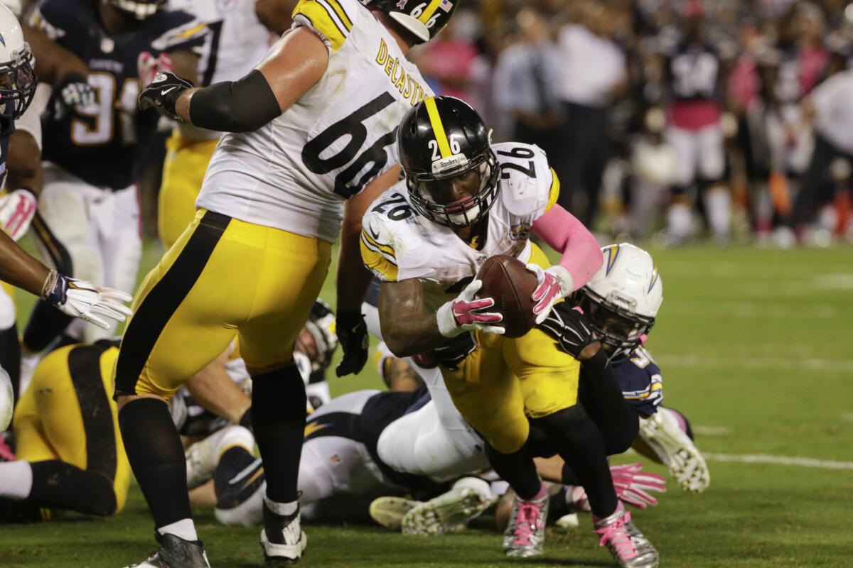 Pittsburgh's Le'Veon Bell scores a touchdown as time expires against San Diego on Monday night.