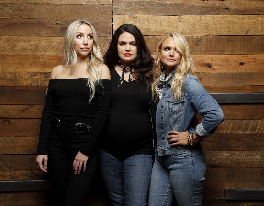 FILE - Ashley Monroe, from left, Angaleena Presley and Miranda Lambert of the Pistol Annies pose for a photo at Sony Nashville on Monday, Oct. 1, 2018 in Nashville, Tenn. The trio released a holiday album“Hell of a Holiday.” (Photos by Donn Jones/Invision/AP, File)