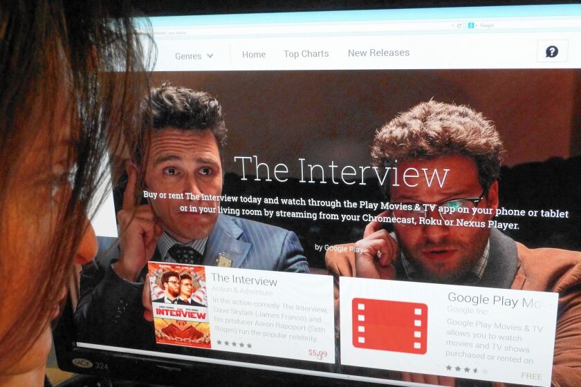 "The Interview” was streamed or downloaded more than 2 million times over the holiday weekend after it was released via video on demand on Christmas Eve, the day before it hit theaters. Above, a woman looks at a Google Play purchase page of "The Interview."
