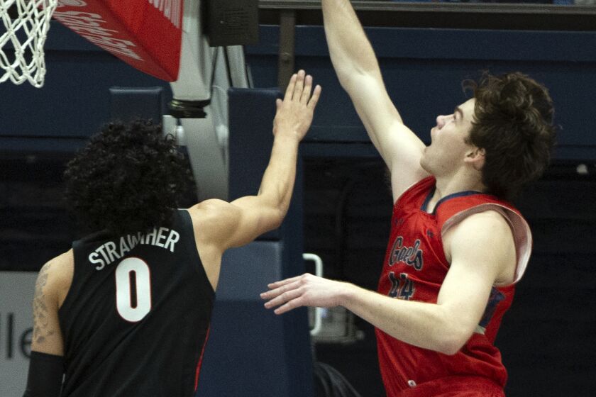 Saint Mary's guard Alex Ducas (44) puts up a shot over Gonzaga guard Julian Strawther (0) during the first half of an NCAA college basketball game, Saturday, Feb. 4, 2023, in Moraga, Calif. (AP Photo/D. Ross Cameron)
