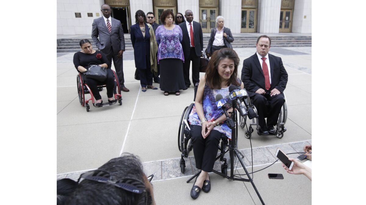 Mei Ling speaks outside the federal courthouse in Los Angeles. The U.S. is joining a whistle-blower lawsuit filed by Ling and a housing nonprofit that alleges L.A. improperly received federal funds by falsely claiming it was following laws that require accessible housing.