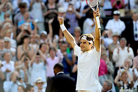 Switzerland's Roger Federer jubilates