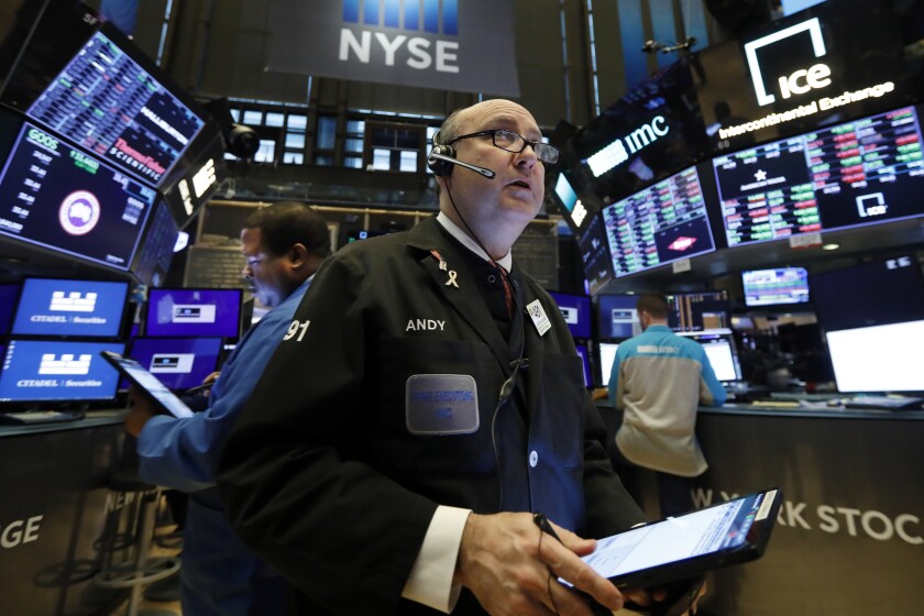 FILE - In this Jan. 10, 2020, file photo trader Andrew Silverman works on the floor of the New York Stock Exchange. The U.S. stock market opens at 9:30 a.m. EST on Wednesday, Jan. 15. (AP Photo/Richard Drew)