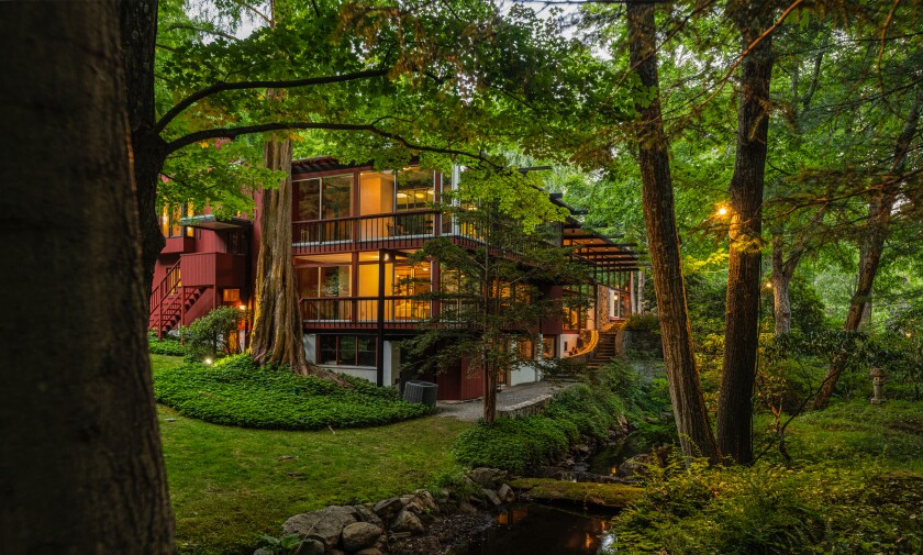 The estate showcases Midcentury and Japanese architecture amid gardens and streams