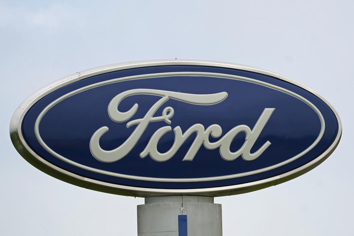 A Ford logo at a dealership