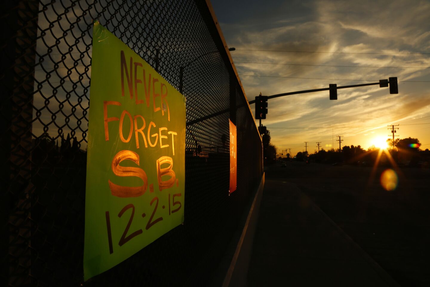 One of several signs supporting the city of San Bernardino hang above the 215 Freeway on Sunday evening.