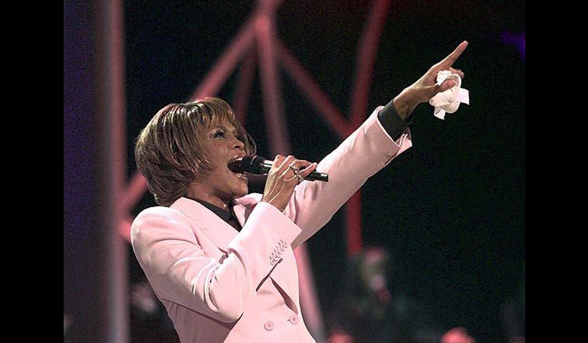 Whitney Houston performs "Until You Come Back to Me" during the 1999 American Music Awards at the Shrine Auditorium in Los Angeles.