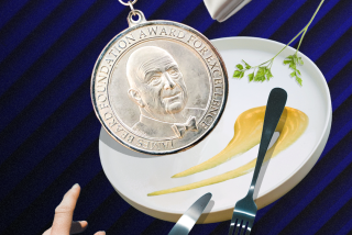 Photo of James Beard Award medal and a plate 