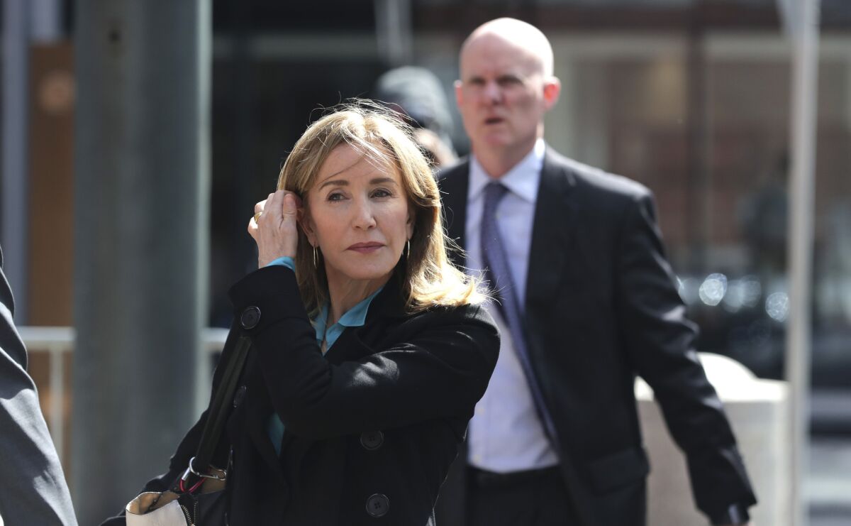 Felicity Huffman arrives at federal court in Boston on April 3 to face charges in a nationwide college admissions bribery scandal.