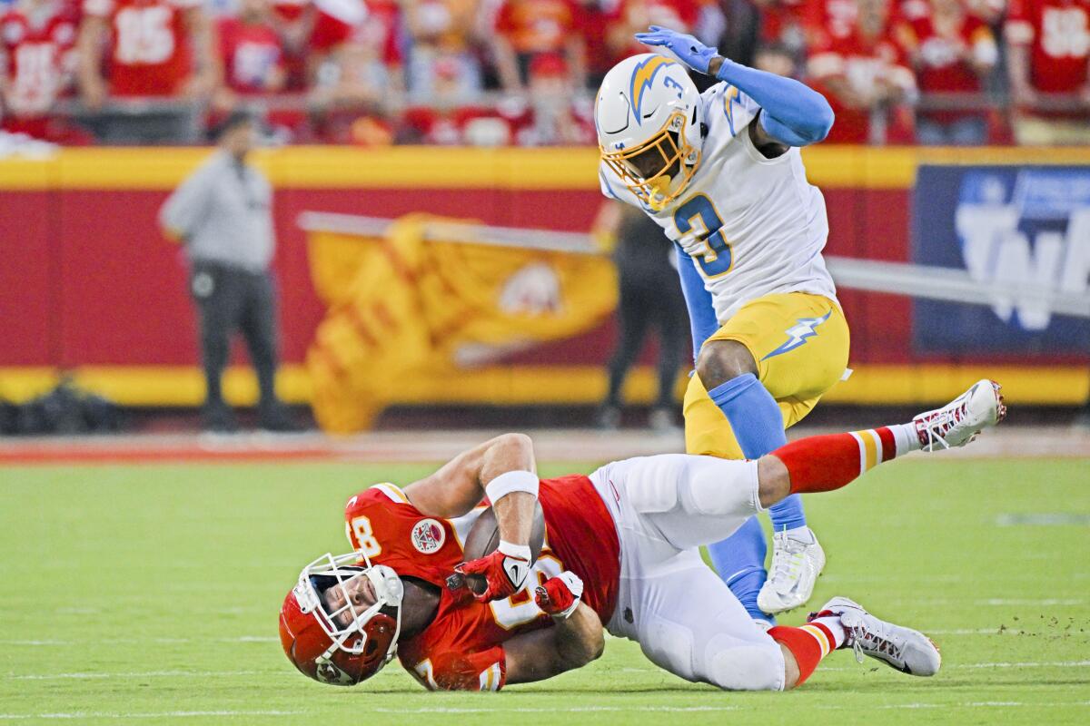 Chargers safety Derwin James Jr. reacts after tackling Kansas City Chiefs tight end Travis Kelce.