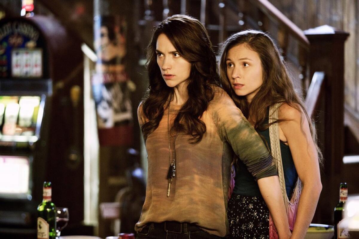 The  "Wynonna Earp" sisters: Wynonna shields younger sibling Waverly.