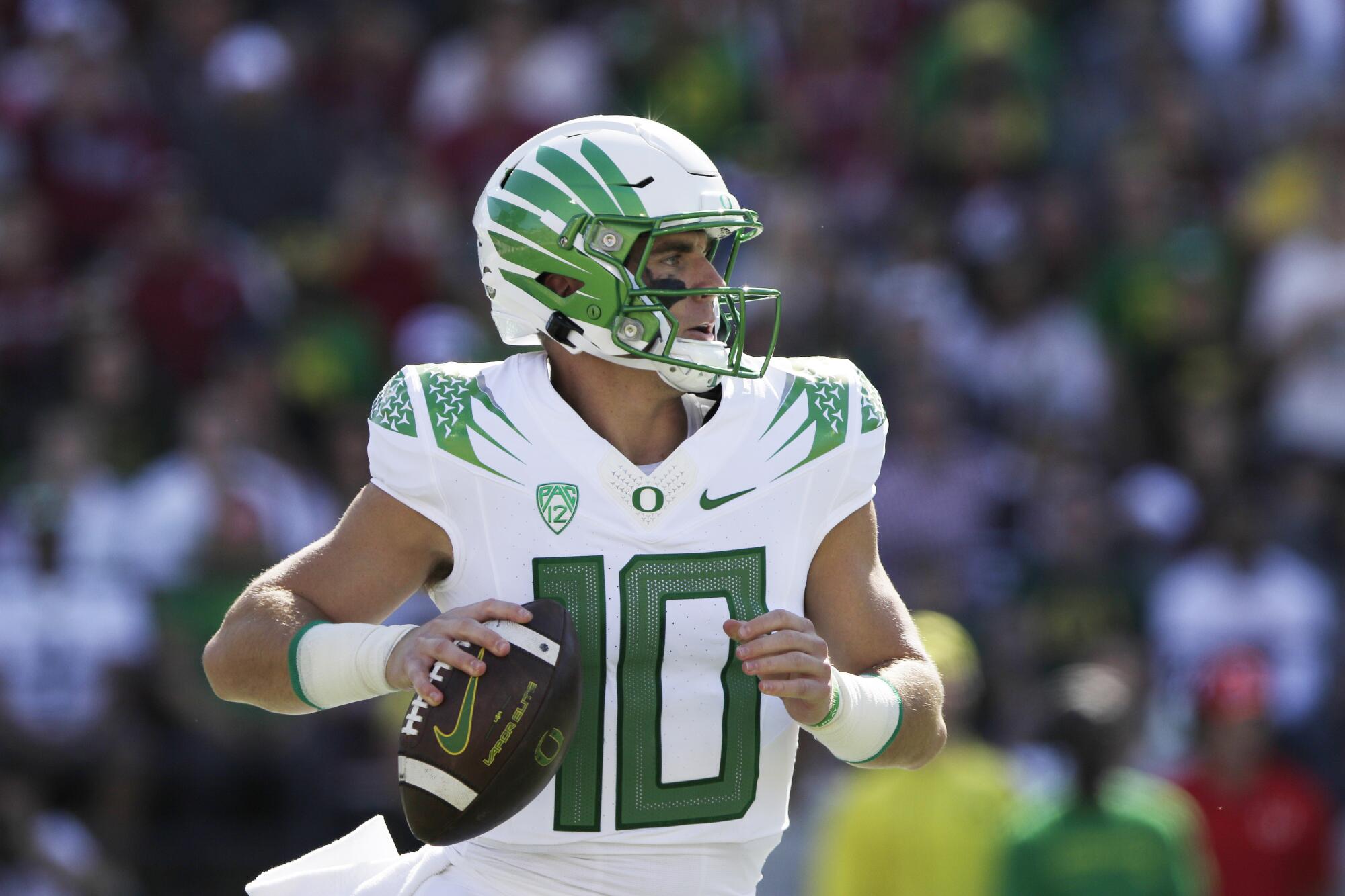 Oregon quarterback Bo Nix looks for a receiver against Washington State on Saturday in Pullman, Wash.